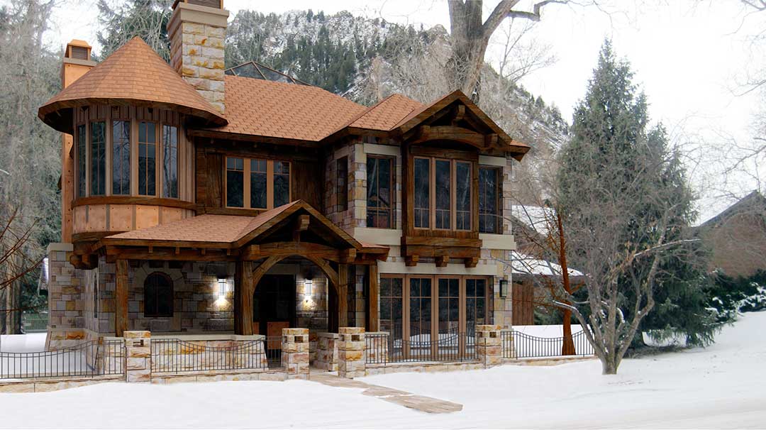 A wide shot of the exterior of a house on a mountain base, surrounded by trees and snow, with a snowy mountain view in the background.